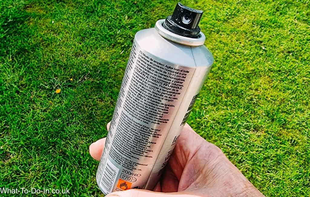 An aerosol with the lid off