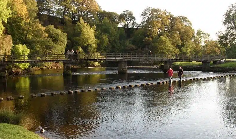 The Stepping Stones and bridge over the river at Bolton Abbey in North Yorkshire
