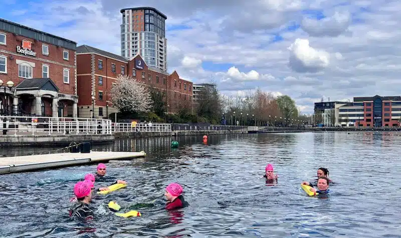 Swimmers in the water at Salford Water Sports Centre in Greater Manchester