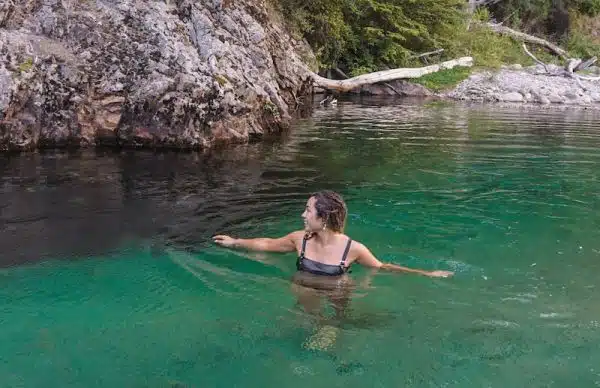 Woman enjoying freshwater swimming in a lake