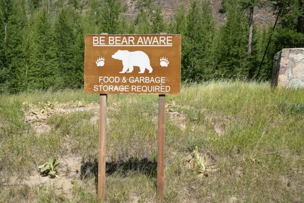 Sign - be bear aware - food and garbage storage required, in grizzly area