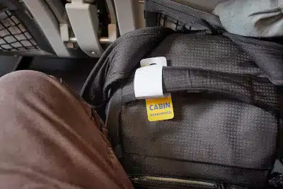 luggage at feet plane seat