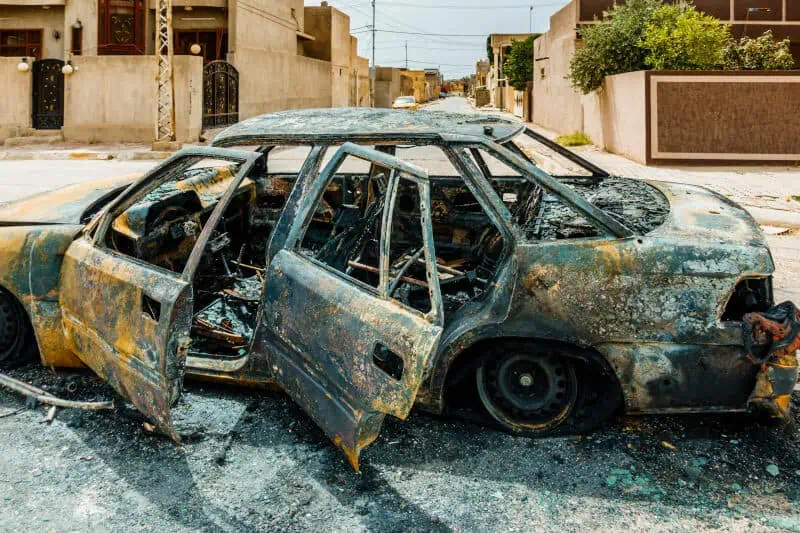 car destroyed in Iraq city street